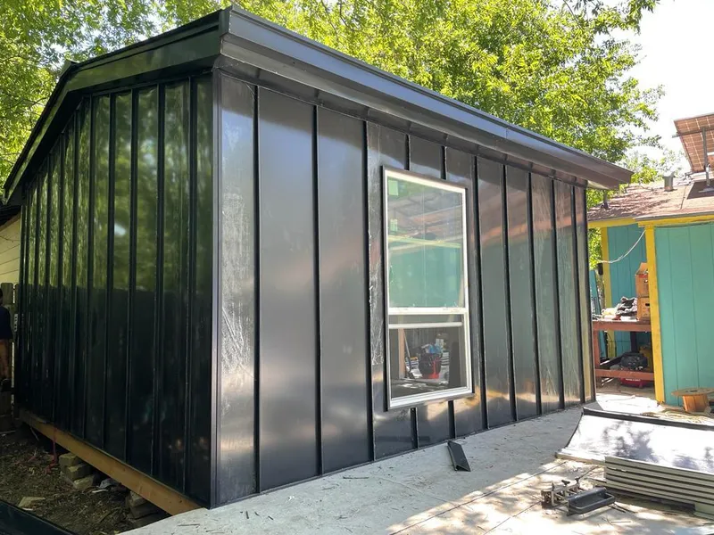 Black standing seam metal wall panels for Metal Roof Installation in Raymondville