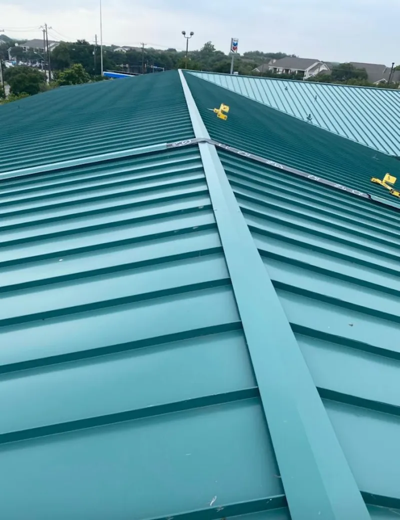 Green commercial metal roof ridge and valley for Metal Roof Repair in Raymondville